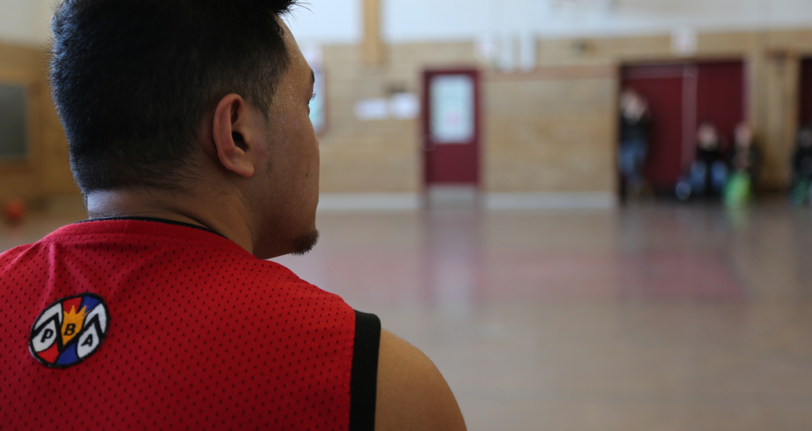 One PBAM member looks on as his team plays a game at West Hill Gymnasium. (Jesse Feith/Concordia Journalism)